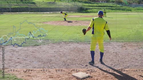 Baseball pitcher delivering pitch, first baseman stepping onto first base catching throw with glove