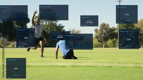Man in blue starting jog, panels floating, preparing for pass, lunging, falling, teammates helping