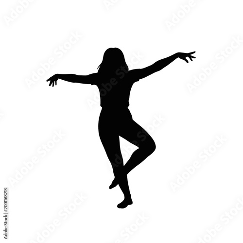 Silhouette of a woman dancing gracefully with arms outstretched and one leg bent.