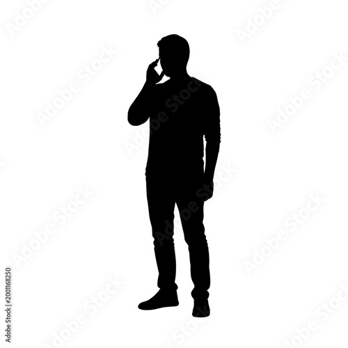 Silhouette of a man standing and talking on a mobile phone, isolated on a white background.