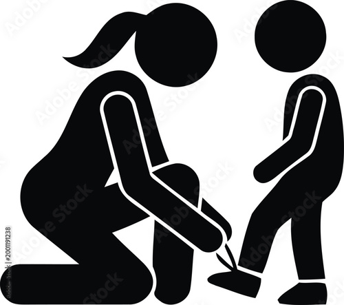 Mother kneeling to tie child's shoelaces silhouetteMother kneeling to tie child's shoelaces silhouette