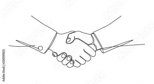 Two people shaking hands together firmly.