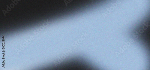 Abstract background with subtle noise texture and soft gradient lighting from dark to light blue tones