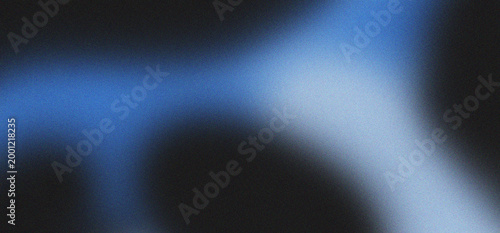 Abstract blue and black grainy gradient background with soft light streaks and diffused bokeh effects creating a moody atmospheric design