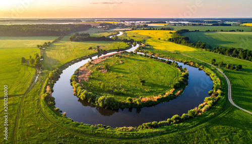 Serpentine River Winding Through Lush Countryside