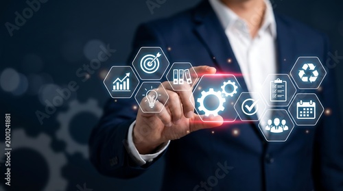 Business leader touching digital gear icon on holographic panel for organizational process optimization and effective workflow management in professional corporate environment