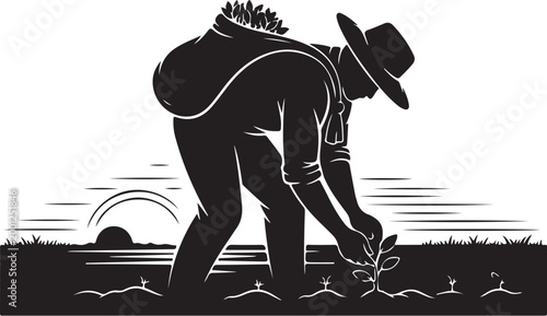 Black silhouette of man planting seedling in field at sunrise