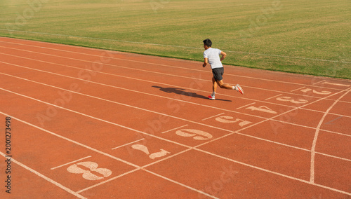 Photos Athlete sprints on a track pushing limits Focused determination propels forward