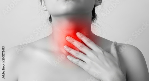 Adult person clutching painful inflamed thyroid gland, experiencing chronic neck discomfort, a common symptom of serious endocrine disease, medical health concept for human anatomy