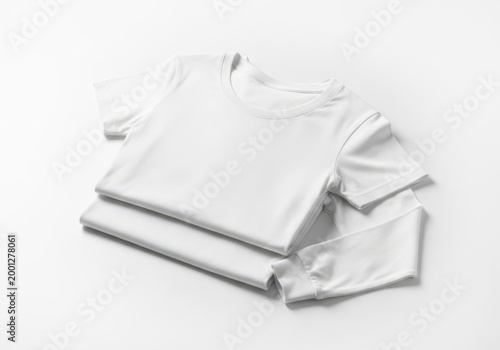 Stack of folded white t-shirts on plain white background minimal product display