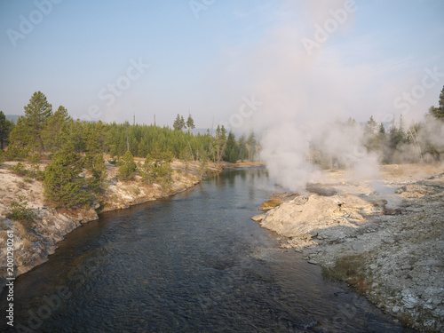 Firehole river banks with hot thermal water creeks runoff from geysers in Yellowstone national park