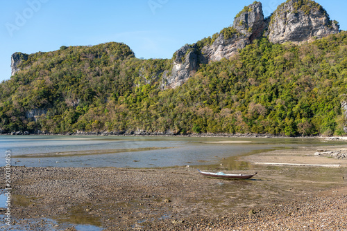 Longtail Boat on Rocky Shore at Low Tide, Koh Phaluai, Thailand