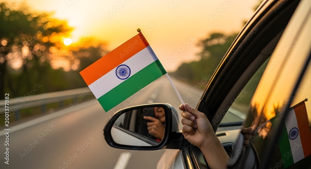 Fototapeta premium Celebrating freedom a vibrant india flag waving on independence day during a scenic sunset drive