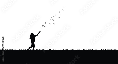 silhouette of person throwing dandelion seeds