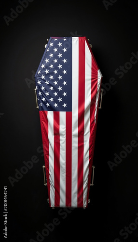Coffin draped with American flag on black background creating respectful tribute. Coffin symbolizes loss while American flag represents patriotism and honor.
