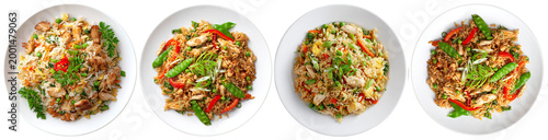 Fotografie Four inviting servings of classic chicken fried rice with vibrant vegetables and tender chicken pieces