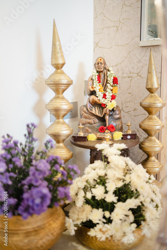Sai baba statue with flower decor 