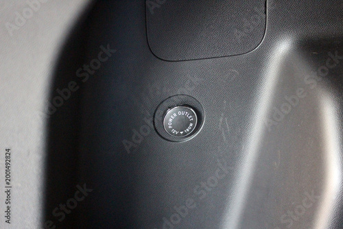 Covered 12V power outlet in the cargo area of a new vehicle
