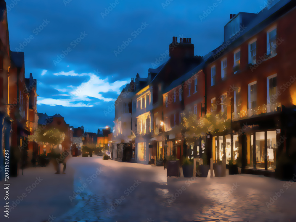Fototapeta premium Evening street scene with illuminated buildings, trees, and cobblestone road