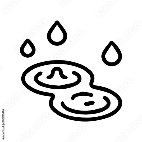 Puddle with falling raindrops
