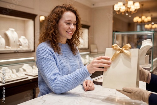 Elegant Woman Purchasing Jewelry at Sophisticated Retail Counter
