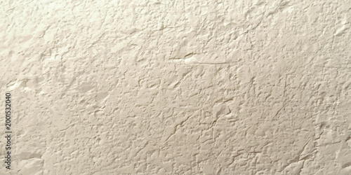 A rough grey concrete wall with a grunge plaster surface and old paper texture patterns creates a blank weathered material backdrop for architecture and construction backgrounds