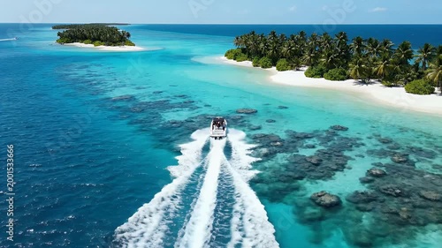 An aerial view showcases a speedboat navigating the turquoise waters of a tropical island paradise.