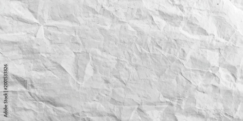 White crumpled paper texture featuring a rough wrinkled surface with a blank creased pattern on an old grunge sheet design material
