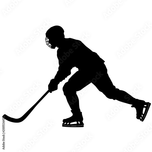Silhouette of a bandy or ice hockey player skating with stick