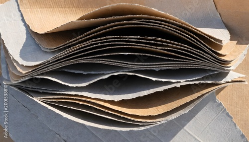 Stacked cardboard sheets with layered gradient casting