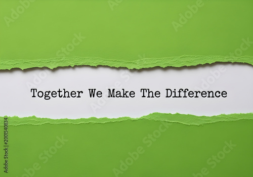 Together we make the difference written on a white paper strip between two torn green paper edges