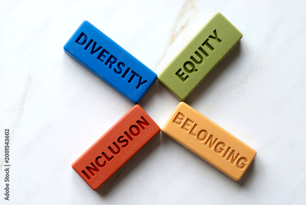 Fototapeta premium Diversity and inclusion concept with colorful wooden blocks spelling equity, belonging, and university