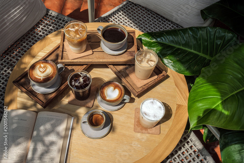 many menu type of coffee set on wooden table