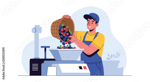 Cheerful factory worker in blue overalls pouring a basket of ripe mixed berries into an industrial processing machine.