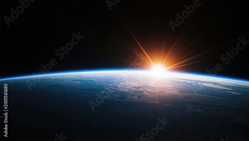 Stunning sunrise over the earths horizon from space, showcasing the planets vibrant atmosphere