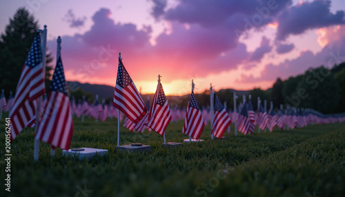 American flags on graves at twilight, honoring Memorial Day