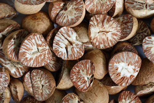 Close up of dried sliced Betel Nut or Areca Catechu, The fruit of the Areca palm.