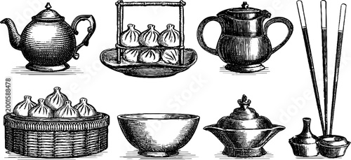 Assorted teaware and dumplings displayed on white surface