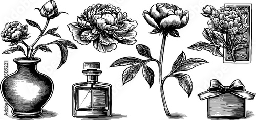 Peony blooms and vase arranged beside perfume and gift box