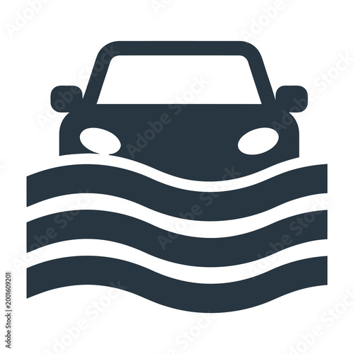 Car driving in flood waters