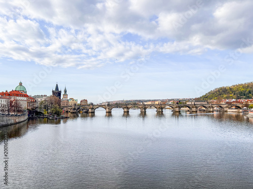 Charles Bridge in Prague and cloudy sky in spring.