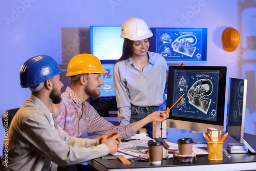 Group of engineers working ...
