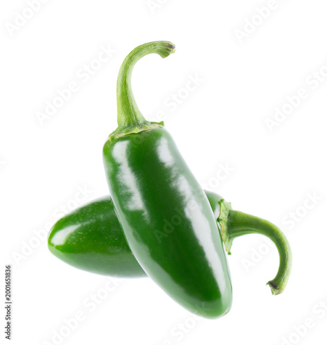 Fresh jalapeno pepper isolated on white background. Slices of green hot serrano pepper. Clipping path.