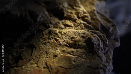 Warm light highlighting rock plateau surface with cinematic texture depth