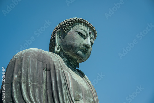 Great Buddha bronze statue under a clear blue sky in Japan