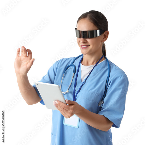 Female doctor in goggles with tablet computer using virtual screen on white b...