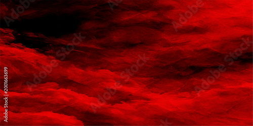 Dramatic red sky with billowing clouds against a dark backdrop creates a sense of foreboding, passion, and intense emotions. 