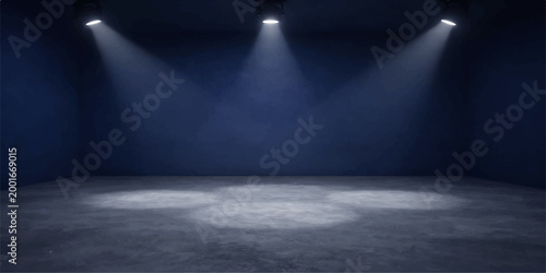 An empty stage sits in a dark concrete theater hall with a single spotlight illuminating the architectural space