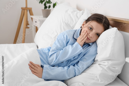 Cute girl suffering from to...