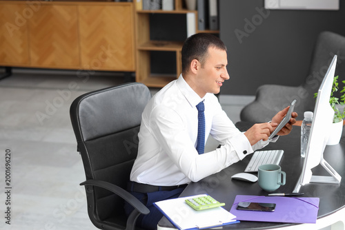 Male accountant working wit...